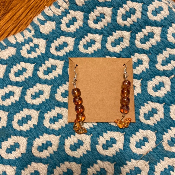 Orange clear earrings with orange butterfly charm - Picture 1 of 1